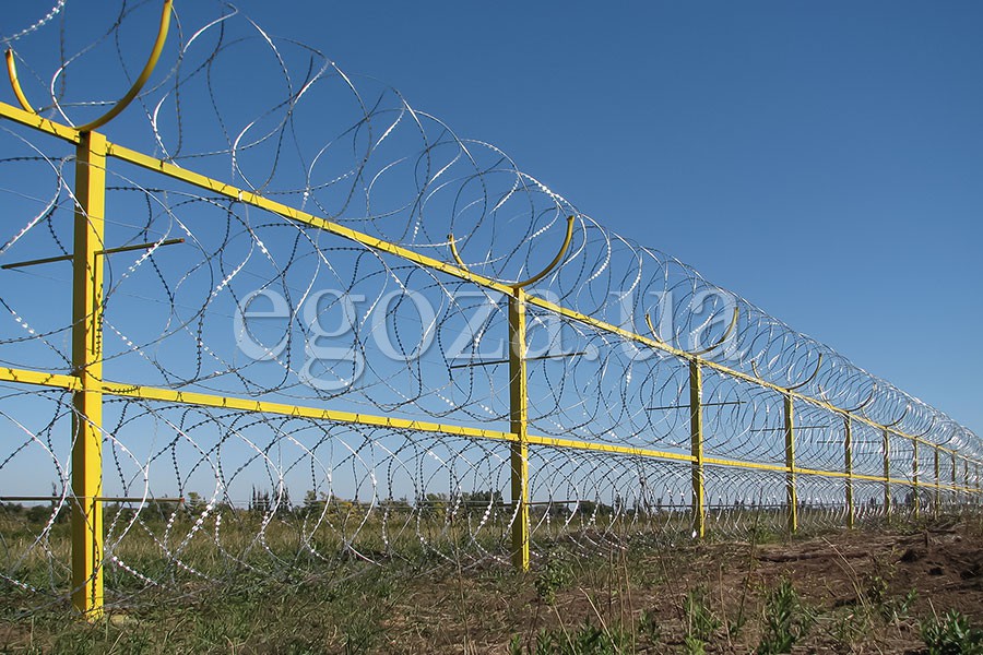 Fence from the razor wire spiral barrier Egoza
